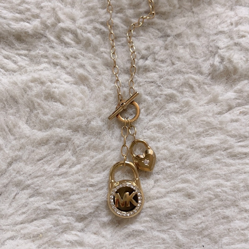 Michael Kors lock gold necklace. Length is Adjustable, New without tags